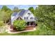 Beautiful two story home with brick accents, lush landscaping, and a covered front porch at 212 Horn Tassel Ct, Indian Trail, NC 28079