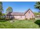 Brick house with a well-maintained backyard featuring a fire pit and a small patio at 227 Donsdale Dr, Statesville, NC 28625