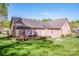 Beautiful brick home with a backyard patio and fire pit, perfect for entertaining at 227 Donsdale Dr, Statesville, NC 28625