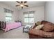 Cozy bedroom featuring a comfortable sitting area, perfect for relaxation or reading a book at 227 Donsdale Dr, Statesville, NC 28625