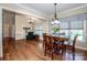 Open dining area with hardwood floors, large windows, and a seamless transition to the living spaces at 227 Donsdale Dr, Statesville, NC 28625