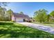 Well-manicured lawn and pristine landscaping highlight this charming home's brick facade and attached garage at 227 Donsdale Dr, Statesville, NC 28625