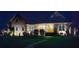 Beautiful brick home at night with manicured lawn and well-lit entrance, creating a welcoming curb appeal at 227 Donsdale Dr, Statesville, NC 28625