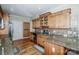 Spacious kitchen with wooden floors, stainless appliances, and light oak cabinetry at 227 Donsdale Dr, Statesville, NC 28625