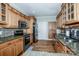 Bright kitchen with wooden floors, stainless steel appliances, light cabinetry, and tile backsplash at 227 Donsdale Dr, Statesville, NC 28625