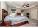 Comfortable bedroom featuring trey ceiling, ceiling fan, and generous floor space at 227 Donsdale Dr, Statesville, NC 28625