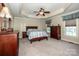 Inviting bedroom with trey ceiling, ceiling fan, and plenty of natural light at 227 Donsdale Dr, Statesville, NC 28625