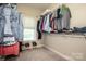 Spacious walk-in closet with ample shelving and hanging space for organized storage of clothes and accessories at 227 Donsdale Dr, Statesville, NC 28625