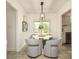 Cozy breakfast nook with modern chairs, a round table, and views of the backyard at 2413 Bergen Ct, Charlotte, NC 28210