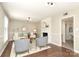 Bright living room featuring hardwood floors, a fireplace, neutral paint, and stylish decor at 2413 Bergen Ct, Charlotte, NC 28210