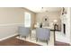Inviting living room with a white brick fireplace, stylish seating, and beautiful hardwood floors at 2413 Bergen Ct, Charlotte, NC 28210