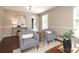 Bright and airy living room with hardwood floors, stylish seating, and modern decor at 2413 Bergen Ct, Charlotte, NC 28210