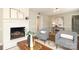 Cozy living room with a fireplace, modern furniture, and ample natural light at 2413 Bergen Ct, Charlotte, NC 28210