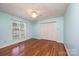 Bedroom featuring hardwood floors, a ceiling fan, and natural light from the window at 2426 36Th Ne Ave, Hickory, NC 28601