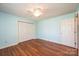 A bright bedroom with hardwood floors, a ceiling fan, and a double door closet at 2426 36Th Ne Ave, Hickory, NC 28601