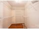 Walk-in closet with ample storage shelves and a hardwood floor at 2426 36Th Ne Ave, Hickory, NC 28601