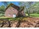 Exterior of a charming brick home showcasing its architectural design and curb appeal in a verdant, shady setting at 2426 36Th Ne Ave, Hickory, NC 28601