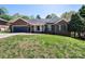 Charming brick home with a well-manicured lawn and attached garage, offering curb appeal and convenience at 2426 36Th Ne Ave, Hickory, NC 28601