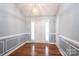 Bright foyer featuring hardwood floors, wainscoting, and elegant lighting at 2426 36Th Ne Ave, Hickory, NC 28601