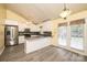 Bright kitchen boasts stainless steel appliances, white cabinets, gray countertops, and a breakfast bar at 2426 36Th Ne Ave, Hickory, NC 28601