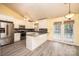 Bright kitchen boasts stainless steel appliances, white cabinets, and an adjacent dining area at 2426 36Th Ne Ave, Hickory, NC 28601