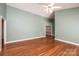 Spacious living room with hardwood floors, a ceiling fan, and ample natural light at 2426 36Th Ne Ave, Hickory, NC 28601