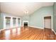 Bright living room with hardwood floors, a fireplace, and access to the outdoor patio at 2426 36Th Ne Ave, Hickory, NC 28601