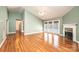 Open living room featuring hardwood floors, a fireplace, and access to the outdoor space at 2426 36Th Ne Ave, Hickory, NC 28601