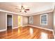 Main bedroom featuring hardwood floors, a ceiling fan, and natural light from the windows at 2426 36Th Ne Ave, Hickory, NC 28601