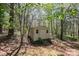 A storage shed nestled in a tranquil, wooded backyard provides ample space for your gardening tools and equipment at 2426 36Th Ne Ave, Hickory, NC 28601