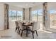 Bright dining room with large windows, modern chairs, and a table set for a meal at 2803 Morning Song Way, Lancaster, SC 29720