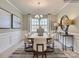 Bright and airy dining room with a modern chandelier, stylish seating, and views to the outside at 2803 Morning Song Way, Lancaster, SC 29720