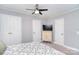 Cozy bedroom offers a ceiling fan, neutral walls, and convenient closet spaces at 2825 Old Pageland Marshville Rd, Wingate, NC 28174