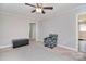 Bright bedroom features a ceiling fan, a decorative rug, and neutral paint at 2825 Old Pageland Marshville Rd, Wingate, NC 28174