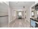 Open-concept dining area with hardwood floors, stylish lighting, and views into the living space at 2825 Old Pageland Marshville Rd, Wingate, NC 28174