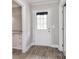 Bright entryway boasts vinyl floors, a glass paneled door, and neutral paint at 2825 Old Pageland Marshville Rd, Wingate, NC 28174