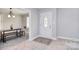 Inviting entryway with a decorative glass door, hardwood floors, and views to the dining room at 2825 Old Pageland Marshville Rd, Wingate, NC 28174