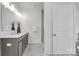Bathroom features dual sinks, stylish vanity, and a glass-enclosed shower at 36131 Greg Norman Dr # 1031, Lancaster, SC 29720