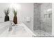 Bathroom showcasing dual vanity sinks and a pristine glass shower at 36131 Greg Norman Dr # 1031, Lancaster, SC 29720