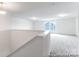 Bonus room features neutral carpet and natural light at 36131 Greg Norman Dr # 1031, Lancaster, SC 29720