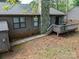 Spacious backyard with a deck and stone chimney, ready for peaceful outdoor living at 380 Sweetgum Dr, Fort Mill, SC 29715