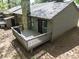 Exterior with a deck and stone chimney perfect for outdoor entertaining and relaxation at 380 Sweetgum Dr, Fort Mill, SC 29715