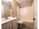 Bathroom boasts a sink, toilet, and shower-tub combo at 380 Sweetgum Dr, Fort Mill, SC 29715