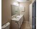 Bathroom has double sinks, tile floors, and medicine cabinet storage at 380 Sweetgum Dr, Fort Mill, SC 29715