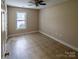 A cozy bedroom with neutral walls, a window, and clean floors at 380 Sweetgum Dr, Fort Mill, SC 29715