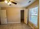A bright bedroom featuring neutral walls, tile floors, and a closet at 380 Sweetgum Dr, Fort Mill, SC 29715