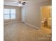 A well lit room with a fan, window and a view of a bathroom at 380 Sweetgum Dr, Fort Mill, SC 29715