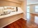 Dining area with hardwood floors features a breakfast bar leading to the kitchen at 380 Sweetgum Dr, Fort Mill, SC 29715
