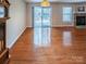 An inviting living room featuring a fireplace, sliding glass doors, and hardwood floors at 380 Sweetgum Dr, Fort Mill, SC 29715