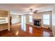 Open-concept living room with hardwood floors, a fireplace, and sliding glass doors to the outdoors at 380 Sweetgum Dr, Fort Mill, SC 29715
